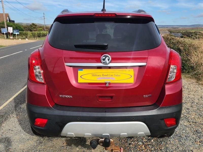 A Velvet Red Metallic Vauxhall Mokka viewed from the back