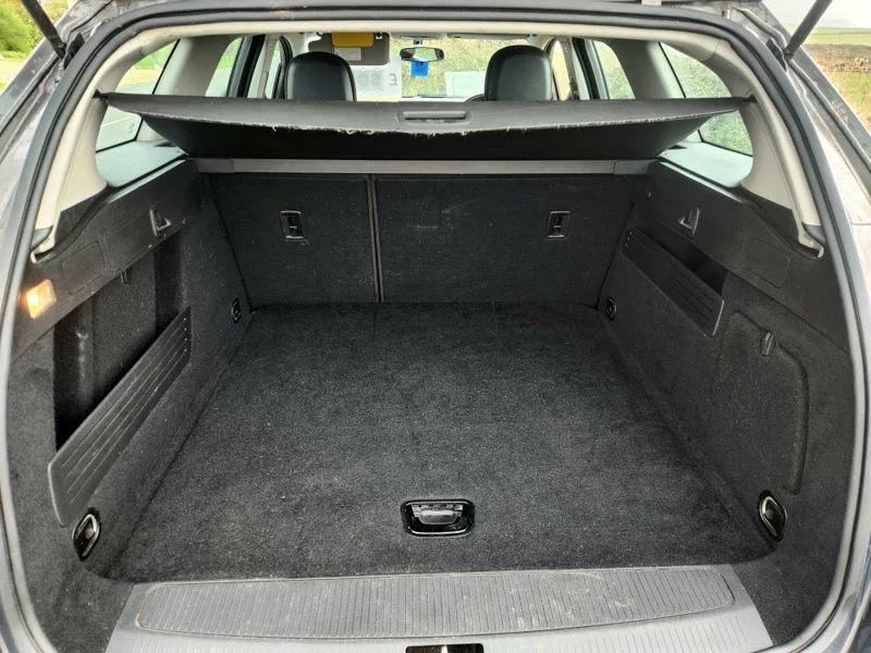 The open boot of a Grey Vauxhall Astra viewed from the back