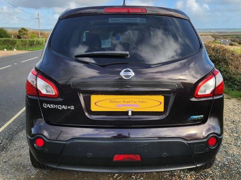 A Nightshade Black Metallic Nissan Qashqai viewed from the back